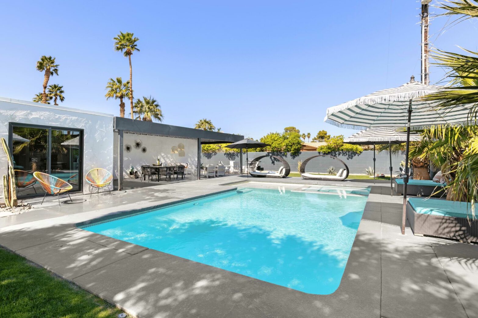 vacation home in coachella valley with a pool and cabanas