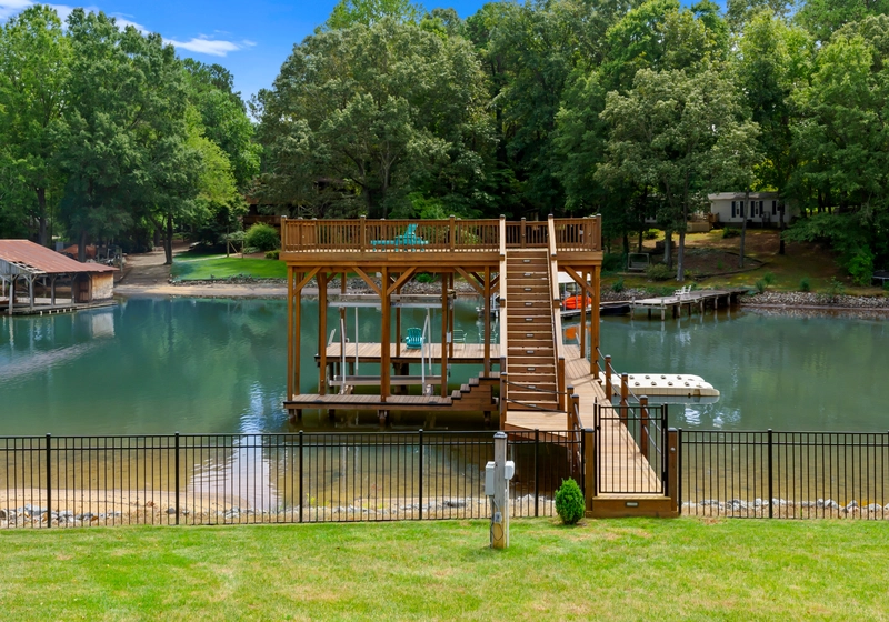 2 story wooden deck and dock for swimming in the green lake making it the best lake norman airbnb