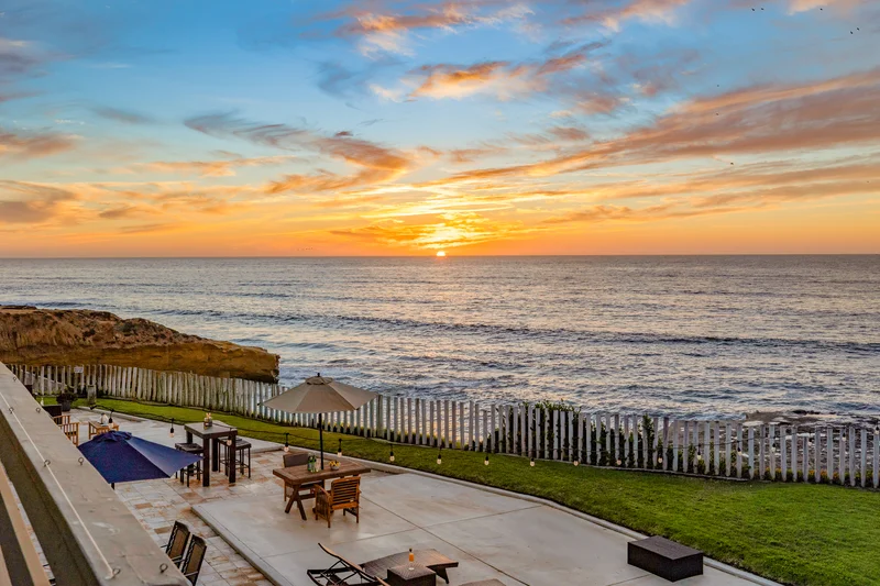 sunset view of the ocean by the cliff with patio