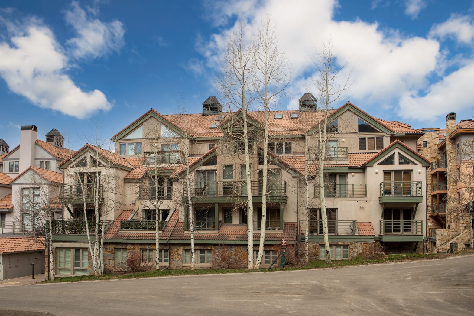 exterior building of a condominium complex with dried trees