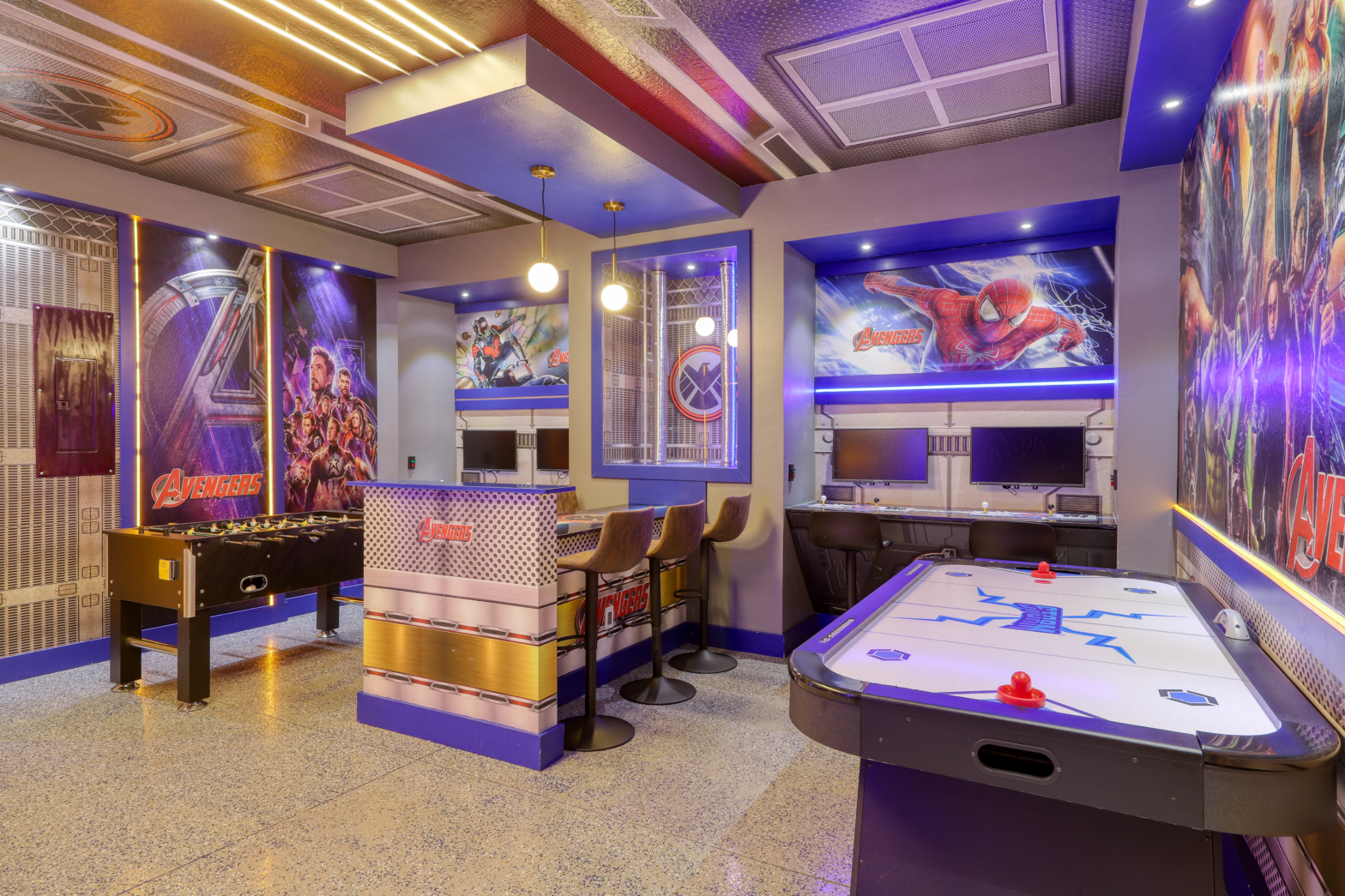 avengers inspired game room with arcade machines and air hockey