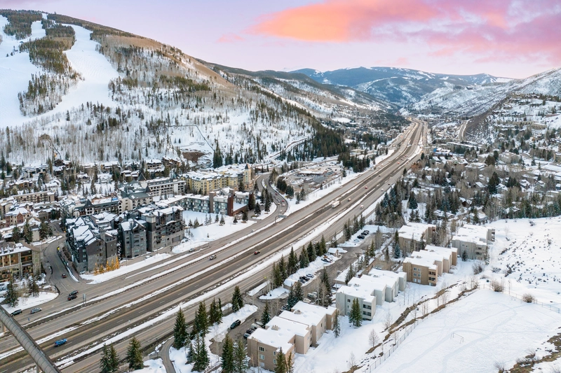 snowy mountains and pine trees in winter road and weather