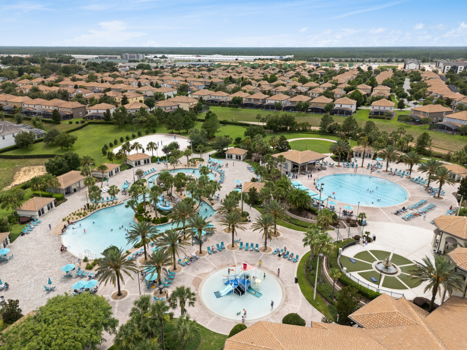 4 different types of turquoise blue pool in an exclusive respot with palm trees
