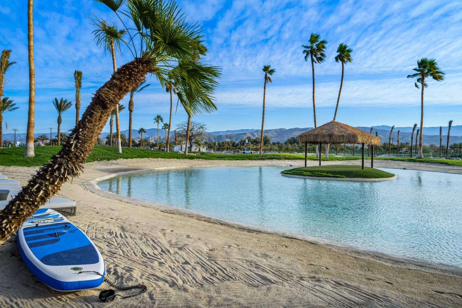 oasis with a kayak and white sand along yucca trees of palm springs