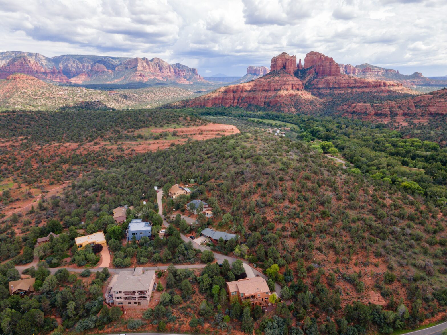 aerial shot of the red rocks views red mountaintop across the valley