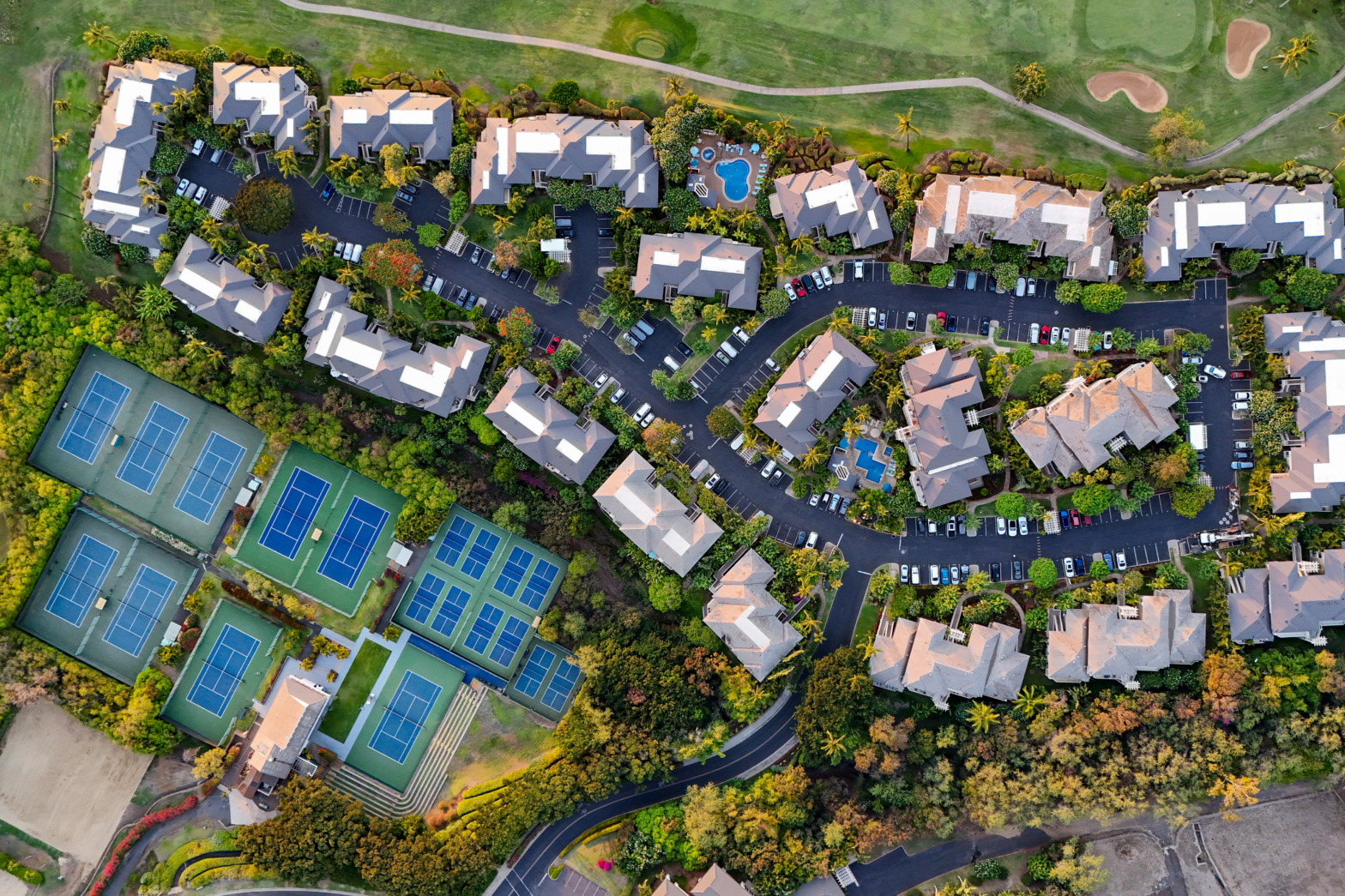 overhead view shot of a house village with 14 courts and a swimming pool